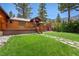 Well-maintained lawn offering a serene setting with easy access to the home's deck at 3935 White Fir Way, Mount Charleston, NV 89124
