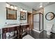 Elegant bathroom featuring double vanities, decorative mirrors, and a glass-enclosed shower at 3935 White Fir Way, Mount Charleston, NV 89124