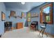 A blue bedroom with natural light and carpet, including decorations and furniture at 3935 White Fir Way, Mount Charleston, NV 89124