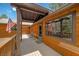 Exterior deck featuring wood paneling, flag, and mountain views at 3935 White Fir Way, Mount Charleston, NV 89124