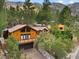 Attractive mountain home with a brown metal roof, large deck, and attached garage at 3935 White Fir Way, Mount Charleston, NV 89124