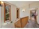 Bright hallway featuring hardwood floors, natural light, and access to other rooms at 3935 White Fir Way, Mount Charleston, NV 89124