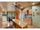 Open-concept kitchen featuring wood ceiling and eat-in dining area at 3935 White Fir Way, Mount Charleston, NV 89124