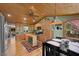 Open kitchen featuring wood ceiling, stainless steel appliances, and an island at 3935 White Fir Way, Mount Charleston, NV 89124