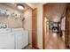 A convenient laundry area with a washer, dryer, and ample storage space at 3935 White Fir Way, Mount Charleston, NV 89124