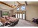 Beautiful main bedroom with vaulted ceiling and mountain views from the large windows and private patio access at 3935 White Fir Way, Mount Charleston, NV 89124