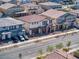 Neighborhood aerial view showcasing new two-story homes with attached garages and desert landscaping at 425 Canary Song Dr, Henderson, NV 89011