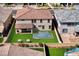 Home with expansive backyard including a pool, patio, and lush landscaping, providing a private outdoor retreat at 425 Canary Song Dr, Henderson, NV 89011