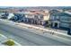 Expansive aerial view of neighborhood showcasing two-story homes, desert landscaping, and street view at 425 Canary Song Dr, Henderson, NV 89011