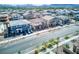 Expansive aerial view of neighborhood showcasing two-story homes, desert landscaping, and street view at 425 Canary Song Dr, Henderson, NV 89011