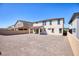 Backyard features desert landscaping, and a covered patio offering a blank canvas for outdoor enjoyment at 425 Canary Song Dr, Henderson, NV 89011