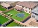 Enhanced backyard featuring green lawn, in-ground pool, patio seating, and carefully curated landscaping at 425 Canary Song Dr, Henderson, NV 89011