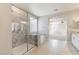 Elegant bathroom with a luxurious shower, soaking tub, and access to a large bedroom space at 425 Canary Song Dr, Henderson, NV 89011
