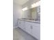 Bathroom vanity with double sinks and granite countertop at 425 Canary Song Dr, Henderson, NV 89011