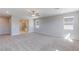 Spacious bedroom with neutral walls and carpet flooring, leading to an en-suite bathroom at 425 Canary Song Dr, Henderson, NV 89011