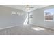 Bright bedroom with a ceiling fan, natural light, and carpet at 425 Canary Song Dr, Henderson, NV 89011