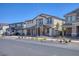 Charming two-story home with a tile roof, stone accents, desert landscaping and two-car garage at 425 Canary Song Dr, Henderson, NV 89011