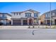 Charming two-story home featuring a stone-accented entrance, a 3 car garage and a well-maintained yard at 425 Canary Song Dr, Henderson, NV 89011