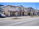 Charming two-story home with a tile roof, stone accents, desert landscaping and two-car garage at 425 Canary Song Dr, Henderson, NV 89011