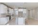 Modern kitchen featuring white cabinets, granite countertops, stainless steel appliances, and a center island with seating at 425 Canary Song Dr, Henderson, NV 89011