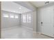 Inviting living room with a large front door, recessed lighting and ample natural light from several windows at 425 Canary Song Dr, Henderson, NV 89011