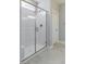 Frameless glass shower with white tile surround at 425 Canary Song Dr, Henderson, NV 89011