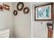 Small bathroom featuring a toilet and shower with decorative artwork on the walls at 4259 Kona Coast Way, Las Vegas, NV 89121