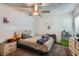 Bedroom featuring a ceiling fan, natural light, and dresser at 4259 Kona Coast Way, Las Vegas, NV 89121