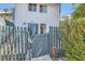 Inviting townhouse featuring privacy fence with whimsical metal art at 4259 Kona Coast Way, Las Vegas, NV 89121