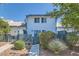 Inviting townhome featuring a fenced yard with mature plants and a blue trim at 4259 Kona Coast Way, Las Vegas, NV 89121