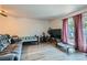 Bright and spacious living room with large windows and laminate floors at 4259 Kona Coast Way, Las Vegas, NV 89121