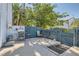 Private back patio with BBQ, seating area, and secure fencing at 4259 Kona Coast Way, Las Vegas, NV 89121