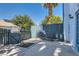 Cozy back patio area with bench seating and privacy fencing at 4259 Kona Coast Way, Las Vegas, NV 89121