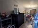 Open living room space with tile flooring, a ceiling fan, and various stored items at 5004 Deep Forest Dr, Las Vegas, NV 89130