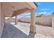 Covered back patio with pavers, supports and a gravel yard at 5517 Meridian Rain St, North Las Vegas, NV 89031