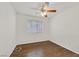 Bedroom with hardwood floors, ceiling fan and a bright window view at 5517 Meridian Rain St, North Las Vegas, NV 89031