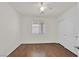 Bedroom with hardwood floors, ceiling fan, window, and closet at 5517 Meridian Rain St, North Las Vegas, NV 89031