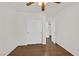 Bedroom with hardwood floors and closet with mirrored sliding doors at 5517 Meridian Rain St, North Las Vegas, NV 89031