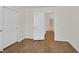 Bedroom with hardwood floors and door entrance to another room at 5517 Meridian Rain St, North Las Vegas, NV 89031
