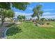 Beautiful view of a community park with grass, trees, and a gazebo at 5517 Meridian Rain St, North Las Vegas, NV 89031