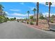 Hartridge community entrance with palm trees and stone signage welcoming residents and guests at 5517 Meridian Rain St, North Las Vegas, NV 89031
