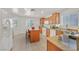 Charming kitchen featuring an island with seating, granite countertops, and ample cabinetry for storage and style at 5517 Meridian Rain St, North Las Vegas, NV 89031