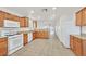 Bright kitchen featuring granite countertops, stainless steel appliances, and tile floors at 5517 Meridian Rain St, North Las Vegas, NV 89031