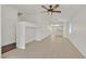 Living room with tile flooring, ceiling fan, and open access to other rooms at 5517 Meridian Rain St, North Las Vegas, NV 89031