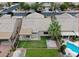 Aerial view showcases the property's well-kept lawn, pool, and proximity to neighboring homes in a desirable community at 5845 Swan Point Pl, Las Vegas, NV 89122