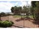 Enjoy scenic views of the golf course from this property, enhanced by a secure fence and lush landscaping at 5845 Swan Point Pl, Las Vegas, NV 89122