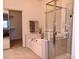 Bathroom featuring shower and tub, with a sliding door to a walk-in closet at 5845 Swan Point Pl, Las Vegas, NV 89122