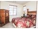 Bedroom with a bed and a large window with wooden blinds at 5845 Swan Point Pl, Las Vegas, NV 89122