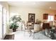 An open-concept dining room and kitchen area featuring modern decor and ample natural light at 5845 Swan Point Pl, Las Vegas, NV 89122