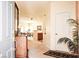 A bright and welcoming foyer with a neutral color scheme and view of the dining room and kitchen at 5845 Swan Point Pl, Las Vegas, NV 89122